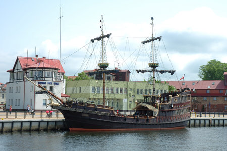 Ustka, Poland - May 24, 2014  Old sailing vessel and unidentified people in harbour in Ustka in Polandのeditorial素材