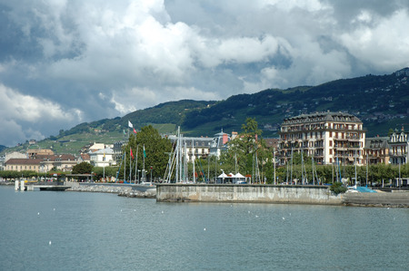 Vevey, Switzerland - August 16, 2014: Buildings in Vevey at Geneve lake in Switzerland. Unidentified people visible.のeditorial素材