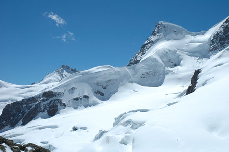 Snow and peaks nearby Jungfraujoch pass in Alps in Switzerland