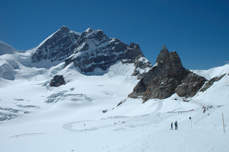 Jungfraujoch, Switzerland - August 18, 2014: Unidentified people on trail on Jungfraujoch pass in Alps in Switzerland.のeditorial素材