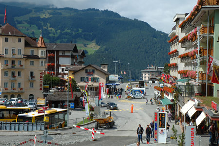 Grindelwald, Switzerland - August 19, 2014: Cars and unidentified people on street in Grindelwald in Switzerland.のeditorial素材