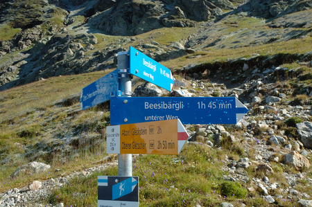 Grindelwald, Switzerland - August 21, 2014: Signs on trail at Glecksteinhutte mountain hostel nearby Grindelwald Alps in Switzerland.のeditorial素材
