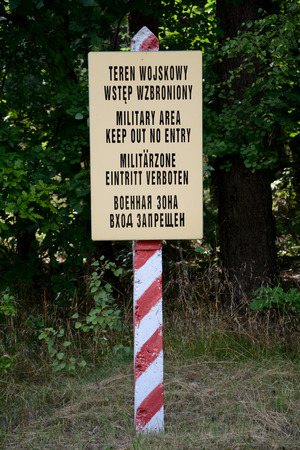 Military area keep out no entry sign in four languages: polish, english, german and russianの写真素材