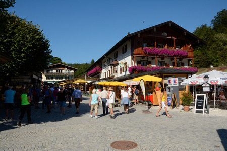 Schonau am Konigssee, Germany - August 30, 2015: Unidentified people on cobblestone street in Schonau am Konigssee in Germanyのeditorial素材
