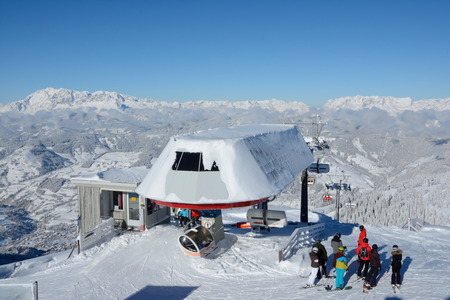Wagrain, Austria - January 18, 2016: Unidentified skiers on slope and ski lift on Griessenkareck mountain nearby Wagrain in Alps in Austria.のeditorial素材