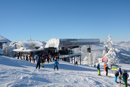 Wagrain, Austria - January 18, 2016: Unidentified skiers on slope and ski lift on Griessenkareck mountain nearby Wagrain in Alps in Austria.のeditorial素材