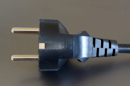 Black electric plug closeup.