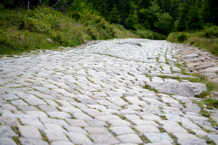 Bumpy cobblestone road. Shallow depth of fieldの写真素材