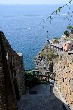 Riomaggiore, Italy - September 4, 2016: Stairs in Riomaggiore city in Liguria, Italy.  One of five Cinque Terre cities (unesco world heritage). Unidentified people visible.のeditorial素材