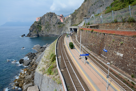 Manarola, Italy - September 4, 2016: Railway station in Manarola city in Liguria, Italy.  One of five Cinque Terre cities (unesco world heritage). Unidentified people visible.のeditorial素材