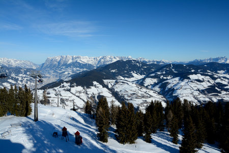 Wagrain, Austria - January 30 2017: Valley, mountains and cable car nearby Wagrain and Alpendorf in Alps in Austria. Unidentified people visible.のeditorial素材