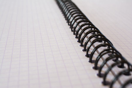 Closeup of spiral metal binding notebook. Shallow depth of field.