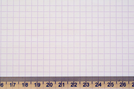Ruler and squared notebook paper texture closeup - background