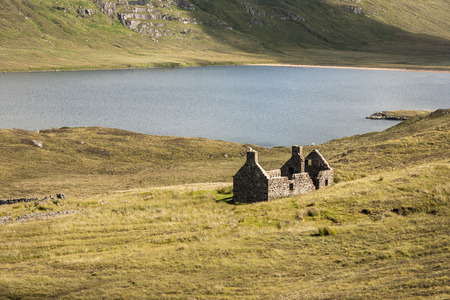 Sandwood Loch & Bothy ruin at Sandwood Bay in Sutherland, Scotland.の写真素材