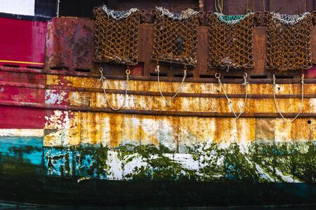 Side of fishing trawler at Gourdon in Aberdeenshire, Scotland.の写真素材