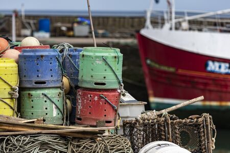 Lobster Pots and Buoys at Gourdon Harbour in Aberdeenshire, Scotland.の写真素材