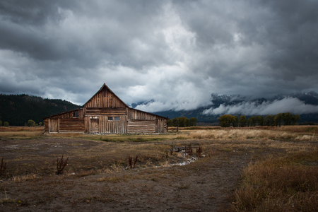 The famous T.A. Moulton barn with Teton range in the cloudsの写真素材