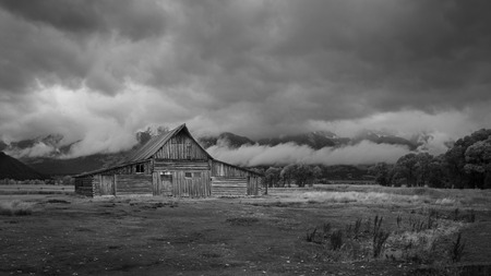 T.A. Moulton Barn with Teton range in the clouds, black and whiteの写真素材