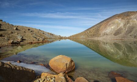 Reflections of emerald lake on Tongariro Alpine Crossing in New Zealandの写真素材