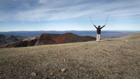 Admiring the view of Tongariro Alpine Crossing from the Red Craterの写真素材