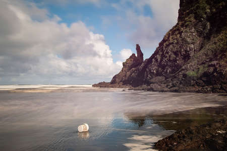 Rubbish litter dumped on the Piha beach, Waitakere, Aucklandの写真素材