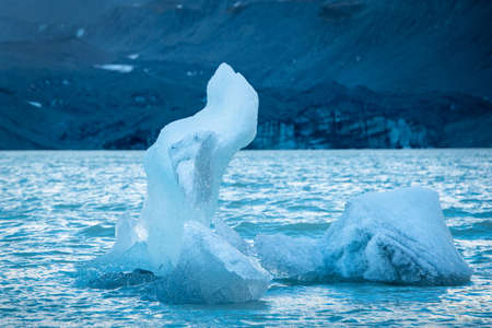 Iceberg floating on the Hooker Lake under Mt Cook, New Zealandの写真素材