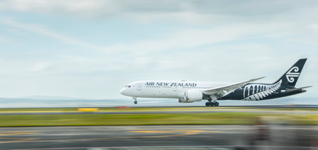 An Air New Zealand flight taking off with front wheels off the ground at Auckland domestic airport. Image captured using camera panning technique.のeditorial素材