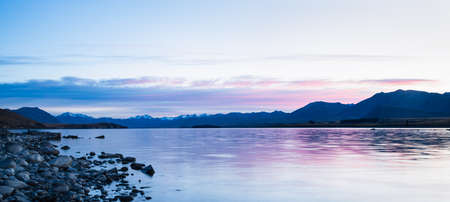 Panorama view of Lake Tekapo with the Southern Alps in the background at sunrise,  Mackenzie country, South Island.の写真素材