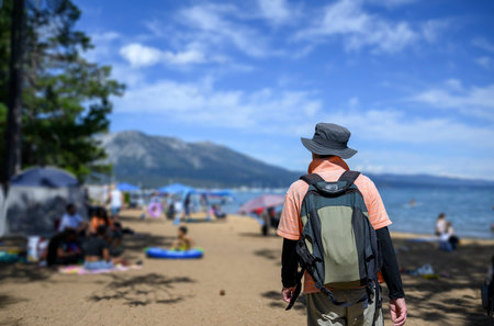 Tourist walking on Pope Beach.  Unrecognizable people enjoying themselves on the sandy beach. South Lake Tahoe.の写真素材