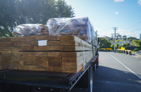 A truck loaded with timber on the road in Aucklandの写真素材