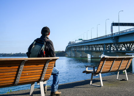 Tourist enjoying the view of Auckland Harbour Bridge.の写真素材