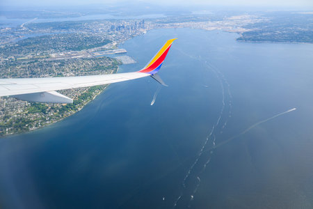 Seattle, USA - Jul 30 2023: Southwest Airlines airplane flying towards Seattle. Aerial view of...