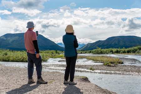 Couple enjoying the mountain views. Denali National Park and Preserve. Alaska. USA.の写真素材