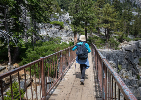 Woman walking on the bridge at Eagle Lake trail. South Lake Tahoe. California.の写真素材