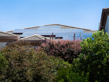 Solar panels on residential house rooftop in California.の写真素材
