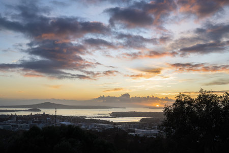 Sunrise at Mt Eden summit. Rangitoto Island in the distance. Auckland.