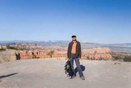 Tourist posing for photos at Bryce Canyon Rim Trail. Utah. USA.の写真素材