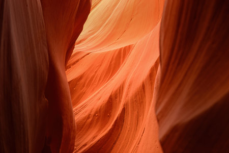 Orange coloured rocks in Antelope Canyon, Arizona, USA. Abstract background. Wallpaper and website concept.の写真素材