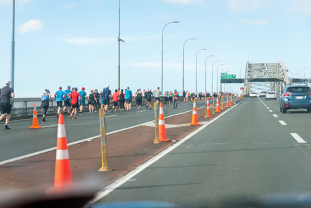 Auckland, New Zealand - October 29 2023: People running on Auckland Harbour Bridge. 2023 Auckland Marathon.のeditorial素材
