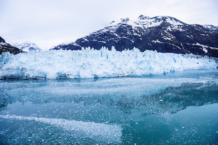 Glacier and mountains reflected in cold waters at Glacier Bay National Park and Preserve. Alaska.の写真素材