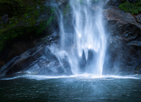 Stirling Falls plunging vertically over the cliff into Milford Sound. South Island. New Zealand.の写真素材
