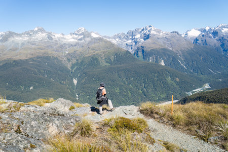 High angle view of man hiking Routeburn Track. South Island. New Zealand.の写真素材
