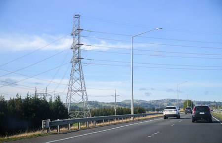 Transmission towers and power lines along the motorway. Auckland.の写真素材