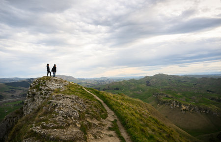 Couple standing on top of the hill. Te Mata Peak. Hawkeâs Bay.の写真素材