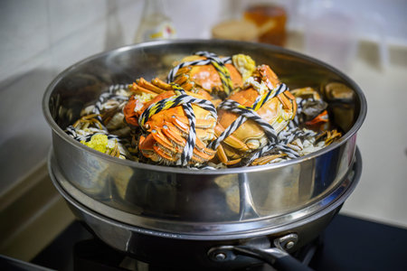 Steamed Yangcheng lake hairy crabs in a pot for family dinner.の写真素材