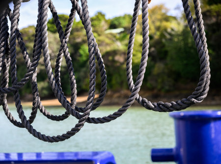 Ropes hanging on a boat approaching the harbour. Russell. Bay of Islands.