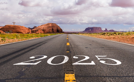 New Year 2025. Text 2025 written on the road to the Monument Valley. Arizona. USA.の写真素材