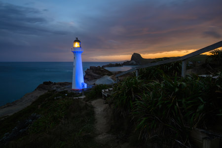 Castlepoint lighthouse lights up in blue at night. Wairarapa. New Zealand.の写真素材