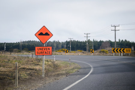 UNEVEN SURFACE road sign on rural road. North Island. New Zealand.の写真素材