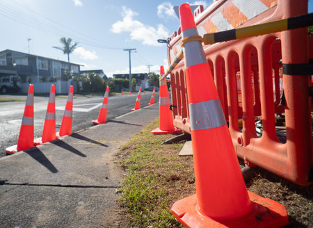 Traffic cones and barrier fences lining up the street. Roadworks in Auckland.の写真素材
